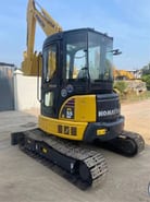 2022 Komatsu PC-55MR mini excavator, front three-quarter view 2022 Komatsu PC-55MR mini excavator, front three-quarter view