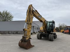 2006 Caterpillar M313C wheel excavator, front three-quarter view