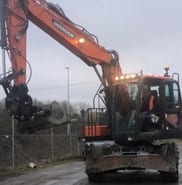 2019 Doosan DX140W-5 wheel excavator, front view 2019 Doosan DX140W-5 wheel excavator, front view