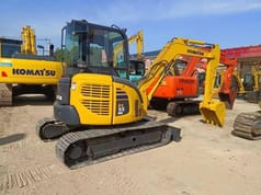 2024 Komatsu PC-55MR mini excavator, rear three-quarter view 2024 Komatsu PC-55MR mini excavator, rear three-quarter view
