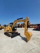 2022 Caterpillar 305.5 mini excavator, front three-quarter view