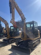 2024 Caterpillar 306E2 mini excavator front three-quarter view 2024 Caterpillar 306E2 mini excavator front three-quarter view