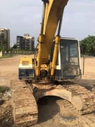 Komatsu PC200-5 Crawler Excavator, rear three-quarter view