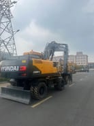 2023 Hyundai R210W-9S wheel excavator rear three-quarter view