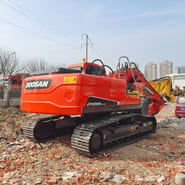 2024 Doosan DX225LC-9C crawler excavator, rear three-quarter view