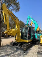 2022 Komatsu 56-7 crawler excavator, front three-quarter view 2022 Komatsu 56-7 crawler excavator, front three-quarter view