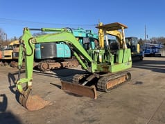 Mitsubishi ME30 mini excavator, side view Mitsubishi ME30 mini excavator, side view