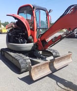 JCB 5 T235 mini excavator, rear three-quarter view with engine compartment open JCB 5 T235 mini excavator, rear three-quarter view with engine compartment open