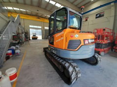 2015 Develon DX85R-7 mini excavator, rear three-quarter view