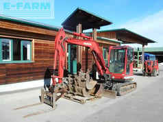 2015 Kobelco SK55SRX-6 mini excavator, side view with attachments