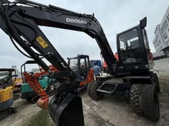 2021 Doosan DX75 wheel excavator, front three-quarter view