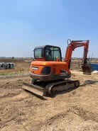 2023 Doosan DX55-9C mini excavator, rear three-quarter view 2023 Doosan DX55-9C mini excavator, rear three-quarter view