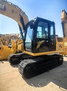 2022 Caterpillar 312GC crawler excavator, side view