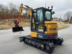 XCMG XE55E crawler excavator, rear three-quarter view XCMG XE55E crawler excavator, rear three-quarter view
