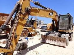 2016 Caterpillar M320F wheel excavator, front three-quarter view