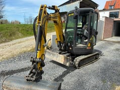 2021 New Holland E26C mini excavator, front three-quarter view 2021 New Holland E26C mini excavator, front three-quarter view
