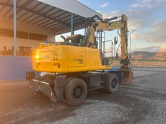 2013 New Holland WE170B wheel excavator rear three-quarter view