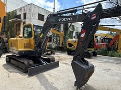 2023 Volvo EC55B mini excavator, front three-quarter view
