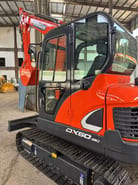2020 Doosan DX60-9C mini excavator, side view of cab and boom