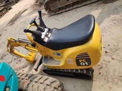 2023 Komatsu PC01 mini excavator, rear three-quarter view
