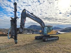 2007 Volvo EC210CL crawler excavator with drilling attachment, side view 2007 Volvo EC210CL crawler excavator with drilling attachment, side view