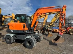 2014 Doosan DX55W wheel excavator, side profile view 2014 Doosan DX55W wheel excavator, side profile view