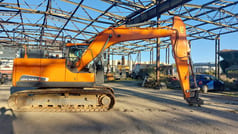 Doosan DX140LC-5 crawler excavator side view