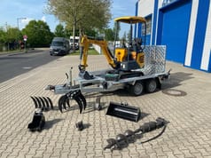 Berger Kraus BK1250JS mini excavator on trailer with attachments