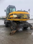 2001 JCB JS130W wheel excavator rear three-quarter view