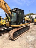 Caterpillar 323D crawler excavator, side view