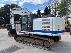2013 Caterpillar 320E crawler excavator, rear three-quarter view
