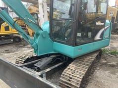 Kobelco SK60 mini excavator, side view