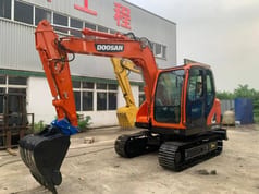 2023 Doosan DX75 mini excavator, front three-quarter view 2023 Doosan DX75 mini excavator, front three-quarter view