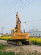 2023 Hyundai R215-7 excavator, rear three-quarter view