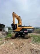 Hyundai 220LC-9 crawler excavator rear three-quarter view