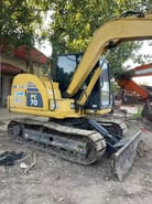 2018 Komatsu PC70-8 mini excavator, rear three-quarter view 2018 Komatsu PC70-8 mini excavator, rear three-quarter view