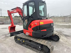 2023 Kubota U55-4 mini excavator, rear three-quarter view