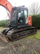2017 Hitachi ZX135US crawler excavator, side view of cab and tracks