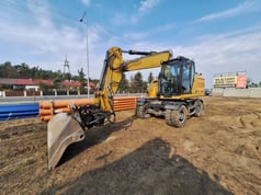 2021 Caterpillar M316 wheel excavator, front three-quarter view