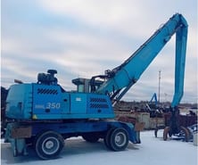 2010 Fuchs MHL350 material handler, side profile view
