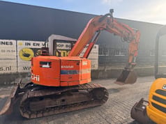 Hitachi EX60UR mini excavator, rear three-quarter view Hitachi EX60UR mini excavator, rear three-quarter view