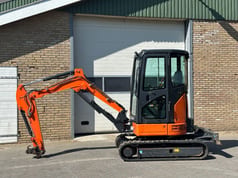 Hitachi ZX26U-6CR mini excavator, side view