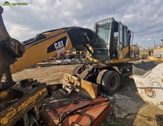 2008 Caterpillar M318D material handler, side view