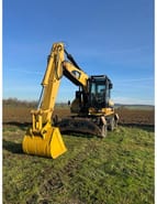 2009 Caterpillar M322D wheel excavator, front three-quarter view