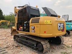 Caterpillar 312D2 GC excavator, rear three-quarter view Caterpillar 312D2 GC excavator, rear three-quarter view