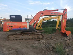 Hitachi Zaxis 210 crawler excavator side view