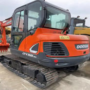 2022 Doosan DX55-9C mini excavator, rear three-quarter view 2022 Doosan DX55-9C mini excavator, rear three-quarter view