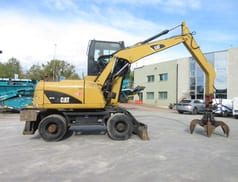 2009 Caterpillar M313D material handler, side view