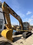 2022 Caterpillar 323D2L crawler excavator, front three-quarter view