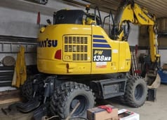 2023 Komatsu PW138MR wheel excavator, rear three-quarter view